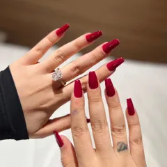 Nothing says confidence like a classic, glossy red. This set features long, coffin-shaped nail extensions in a vibrant, deep red that is timelessly glamorous and demands attention.