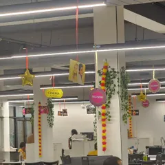 Here is a closer look at the ceiling decorations for the Bollywood party. I used a combination of hanging photos, film-themed signs like "Cinema" and "Bollywood," and traditional flower garlands to create layers of visual interest.