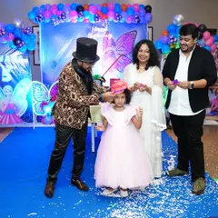 The birthday girl gets to be the magician. I guide her and her parents through a fun trick, creating a wonderful family memory at her party.