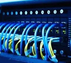 A close-up of a network switch after setup, with all connections active and running smoothly. We make sure everything is tested and working perfectly.