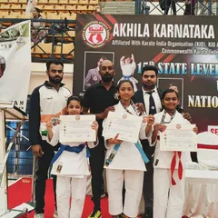 Our students proudly display their certificates and medals after a successful performance at the 15th State Level Karate Championship.