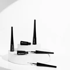 A high-key, minimalist product shot in black and white. This style is perfect for creating a sophisticated and modern feel, focusing purely on the form and branding of the Bella Vita eyeliner.