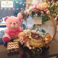 Celebrate Teddy Day or a new baby announcement with a sweet and charming gift basket. This hamper combines our handmade chocolates with adorable teddy bears and elegant floral arrangements for a truly special surprise.