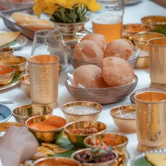 The joy of a shared meal. Our Sadya ON A ThAli (SONATA) for Diwali brings friends and family together around a table laden with the diverse flavours of Kerala.