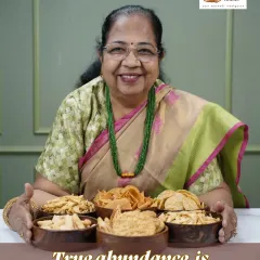 This is our Dadisaa, Usha, with the snacks she loves to make. For us, true abundance isn't just about having a lot, it's about having food that is wholesome, nourishing, and made with love. This is the goodness we pack in every order.