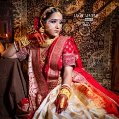 Master the art of regional bridal makeup with our specialized training. This stunning Bengali bridal look, inspired by the elegance of "Paro," showcases the intricate details, from the traditional chandan art to the classic red and gold saree styling.