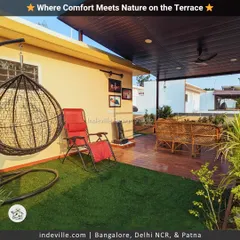Here, I've created a personal escape on the terrace. The space is layered with a soft turf area, a wooden deck with cane furniture under a shaded roof, and a hanging swing chair, making it perfect for any time of day.