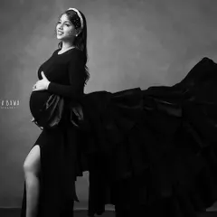Drama and elegance in monochrome. The elaborate ruffles of this black gown create incredible texture and movement, making for a powerful black and white fashion portrait.