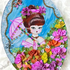 A full view of an oval wall art piece featuring a cute, vintage-style girl holding an umbrella, surrounded by a garden of colorful 3D flowers. This piece blends painting and sculpture.