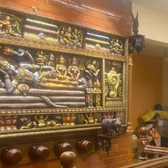 Another view of the Ranganathaswamy panel in our client's home. This angle shows how the large panel integrates with the traditional brick and wood interior, creating a cohesive and grand aesthetic.