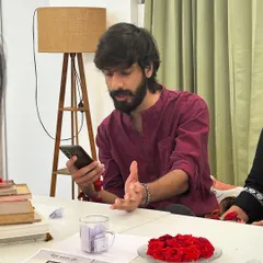 An artist passionately discusses a piece of literature during our "Guftugu" meetup.