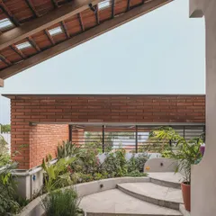 This rooftop was transformed into a lush terrace garden. By using built-in planters and a mix of native plants against an exposed brick wall, we created a secluded green retreat with open sky views.