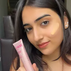 Showcasing the Lakmé CC Cream. This content is perfect for demonstrating daily-use products, emphasizing its benefits like sun protection and a natural, tinted glow.