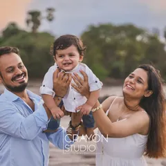 A joyful lift into the air brings out the biggest smiles. This happy, interactive portrait against the soft light of the beach captures the pure delight of being together as a family.