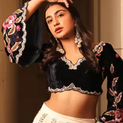 This look is about modern festive glamour. I paired a soft, glowing makeup look with a contemporary embroidered velvet blouse, creating a perfect balance for a sangeet or reception party.