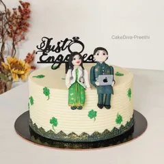 An engagement cake for a doctor and an IT professional. I created custom fondant figures to represent the couple, complete with a stethoscope and a laptop. The cake inside was a green-colored vanilla sponge to match the theme.