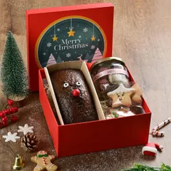 Our Christmas treat boxes make the perfect gift. This one features a cute reindeer-themed plum loaf cake alongside a jar of our assorted holiday cookies.