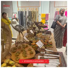 A rustic and chic setup for an event catering at a launch. The use of natural wood platters and decorative elements creates a warm and inviting atmosphere for guests.