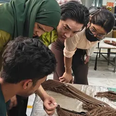 At Savi Fashion Apparel, students get a close look at leather crafting techniques, understanding the details that go into producing high-quality leather goods for global brands.