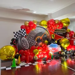 Another angle of the dynamic Ferrari stage, capturing the full spread of balloons and props.