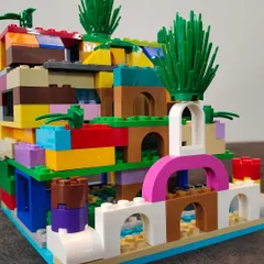 From a pile of bricks to a architectural marvel! This colorful structure, built by one of our young creators, shows the incredible imagination and skill that our LEGO workshops help unlock.