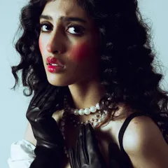 This shot captures the theatrical and emotive quality of the makeup, perfect for a conceptual editorial story.