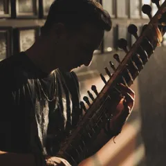 A silhouette shot of me practicing in the studio. The creative process requires deep focus and dedication, which I bring to every project I undertake.