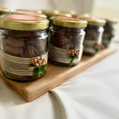 Our chocolate-roasted almond jars, beautifully decorated with custom ribbons and embellishments, make for a sophisticated and delicious corporate gift.