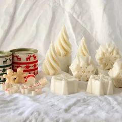 Welcome to our Christmas wonderland. A festive spread of our spiral trees, snowflake candles, and gingerbread wax melts.