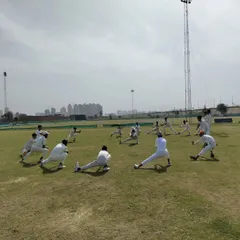 Our warm-ups are not just about running. We focus on dynamic stretching and mobility exercises like these side lunges to prepare your muscles for explosive cricketing movements and reduce injury risk.