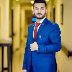 Every man deserves to look and feel attractive on a special day. This client is styled in a classic blue suit with a red tie, and my grooming work ensures his hair and skin are picture perfect.