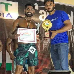 Holding my trophy and certificate. This is a reminder that with hard work, you can achieve your goals.