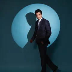 A dynamic shot showing the suit in motion. This demonstrates how a well-styled formal look can be both powerful and comfortable.