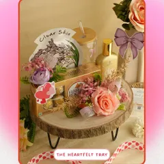 The Heartfelt Tray is perfect for expressing your love. This beautifully arranged gift on a rustic wooden tray includes skincare, perfume, and Ferrero Rocher chocolates, making it an ideal gift for anniversaries or Valentine's Day.