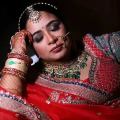 A serene portrait of a bride with her eyes closed, capturing a moment of calm and reflection on her wedding day.