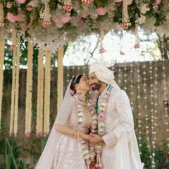 Sid and Kanika share an intimate moment during their pheras, surrounded by the grandeur of their palace wedding in Jaipur.