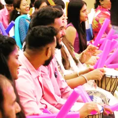 A close-up of the team's engagement during a musical boomwhacker and drum jam session for Suryoday Bank. I focus on capturing individual expressions of joy and teamwork during corporate activities.