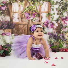 A crawling shot showing the baby's curiosity and movement. The beautiful lavender floral setup in our studio makes for a stunning background.