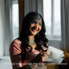 The pure joy on a bride's face as she reads a letter from her love. She read it slowly, as if she didn't want the moment to end, a beautiful, private smile just for him.