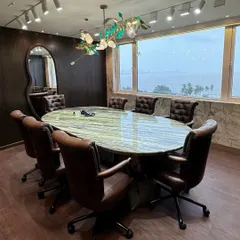 This conference room proves that a workspace can be both functional and inspiring. I chose a vintage, classy theme with rich leather chairs and a stunning green marble tabletop, all set against a breathtaking sea view. It’s a space designed for clear thinking and powerful decisions.
