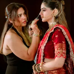 Here I am in my element, demonstrating a detailed technique on a model during a live masterclass. You get a close-up view of every step, allowing you to learn the precise application methods I use for professional results, like perfecting the nose contour and highlight.