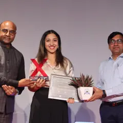 Receiving the speaker's award after my talk. This moment represents so much more than an award; it's a validation of the path I've chosen and the stories I am trying to tell.