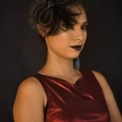 If you want something bold for a photoshoot or a party, I can create that too. This high-fashion look uses dramatic dark lips and a sharp, clean eye, perfect for making a statement.