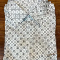 Another example of a finished printed formal shirt, this time with a lighter, intricate pattern on a white cotton base for a crisp, clean look.