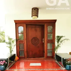 Our work often blends modern living with timeless traditions. This home entrance in Coimbatore features a beautifully carved wooden door and red oxide flooring, creating a warm, vernacular welcome that honors its cultural roots.