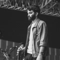 A monochrome shot capturing a quiet, emotional moment during a live performance. Whether it's a high-energy song or a soft ballad, I always sing from the heart.