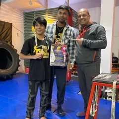 Another shot of Erhaan with his coaches and his gold medal. We are incredibly proud to nurture young talent and help them achieve their potential.
