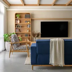 The 'Cover me in Sunshine' living room embodies a modern cottage vibe, with exposed rafters, arched entryways, and a soothing palette of beige and blue.