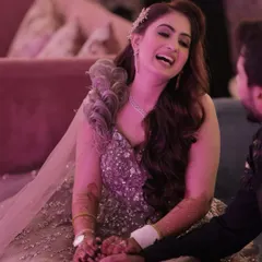 Laughter and love. This candid shot shows how her makeup looks just as beautiful in moments of joy. The long-wear formula ensures it stays perfect through the entire event.