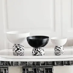 This trio of bowls from our Uma Black Collection showcases a blend of monochrome elegance. The contrasting patterns and clean lines make them a sophisticated decorative accent for any modern space.